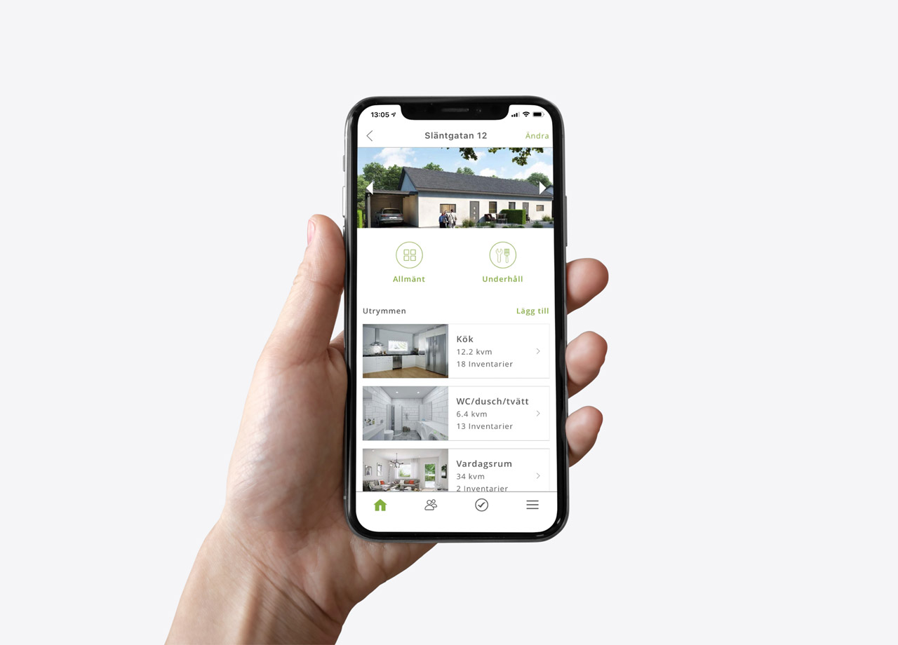 Hand som håller mobil som visar en bostadsapp.
