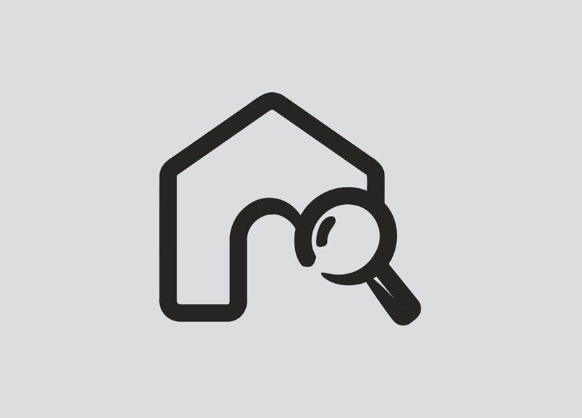 Illustration av hus och förstoringsglas mot blå bakgrund